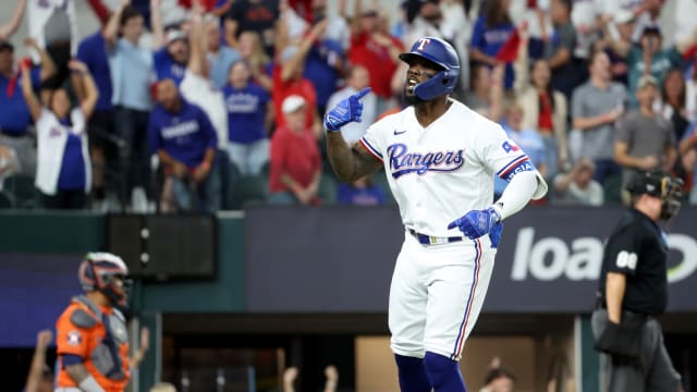 Oct 19, 2023; Arlington, Texas, USA; Texas Rangers right fielder Adolis Garcia (53) reacts after hitting a solo home run during the second inning in game four of the ALCS against the Houston Astros for the 2023 MLB playoffs at Globe Life Field. Mandatory Credit: Kevin Jairaj-USA TODAY Sports